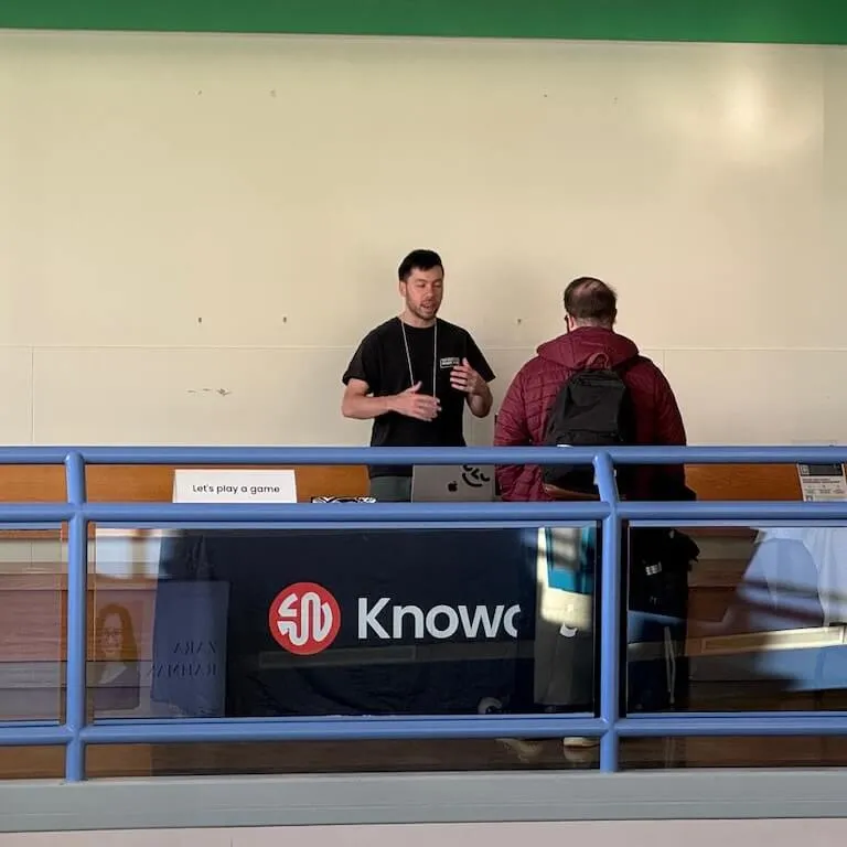 Trevor talking with a teacher about Knoword